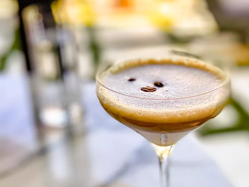A glass holds an espresso martini at Catbird, one of the best Dallas spots for a Valentine's Day date.