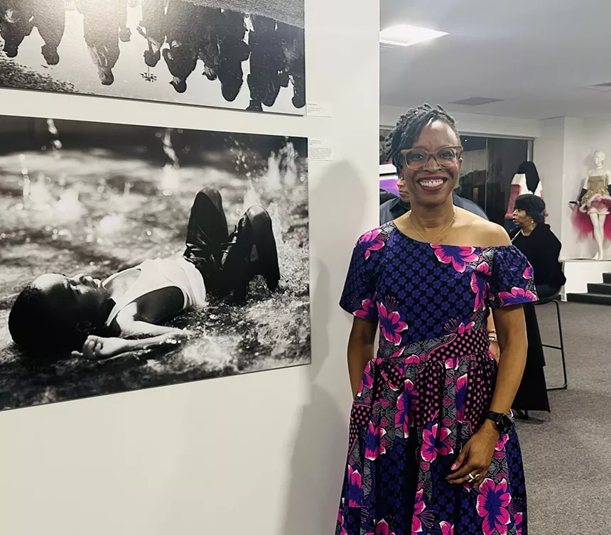 Dallas College photography student Teresa Jackson with her piece titled "Unbothered."