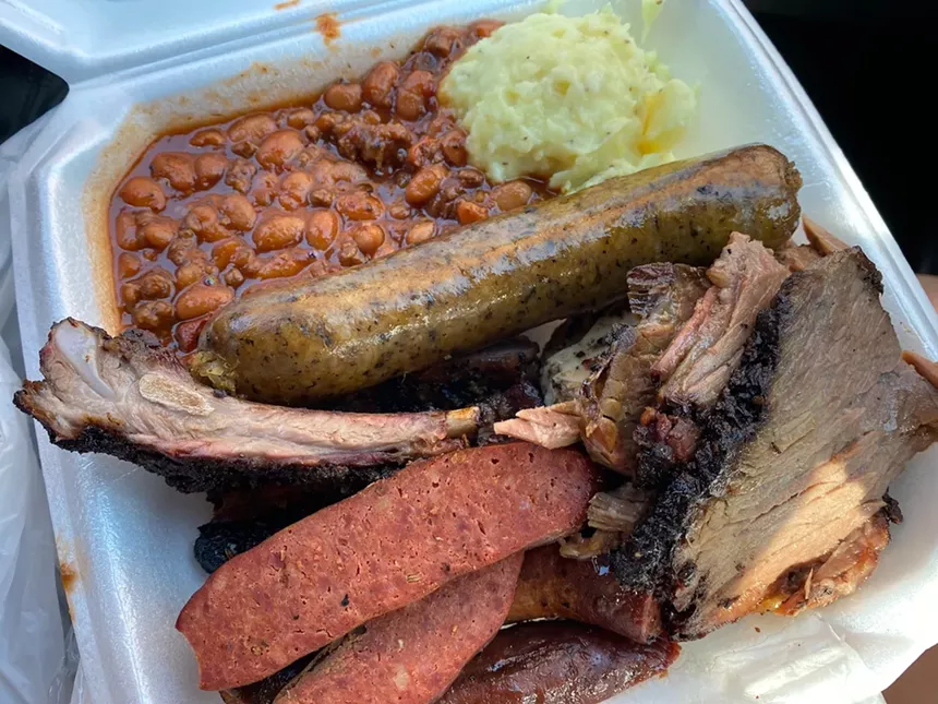 a plate of boudin along with brisket and ribs at Baby Back Shak