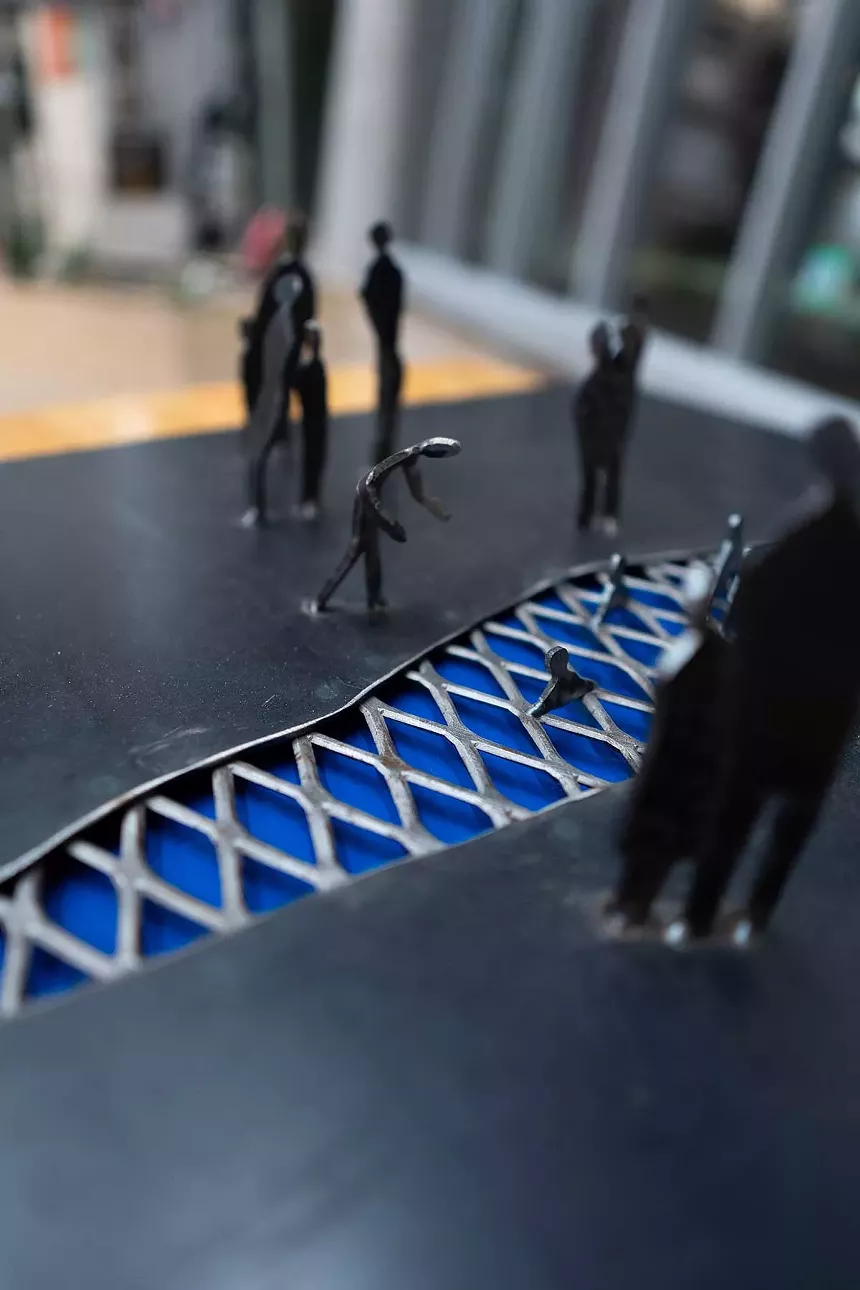 An image of a sculpture representing immigrants crossing the U.S. Mexico border.