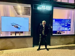 James Talambas stands in front of The New Media Contemporary in Dallas.