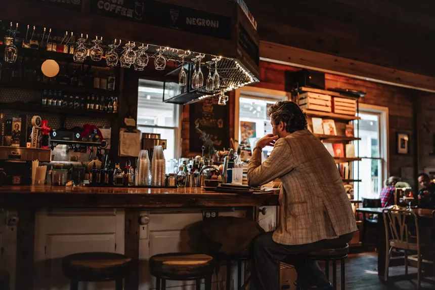 Man sitting at The Wild Detectives in Dallas.