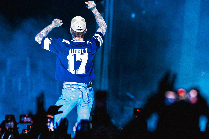 Man on stage wearing jersey