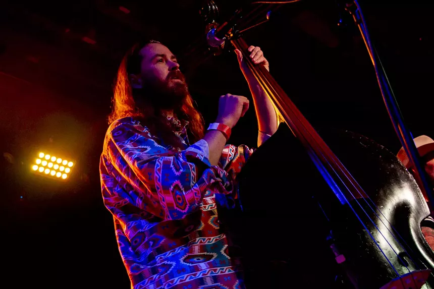 Man playing the bass on stage