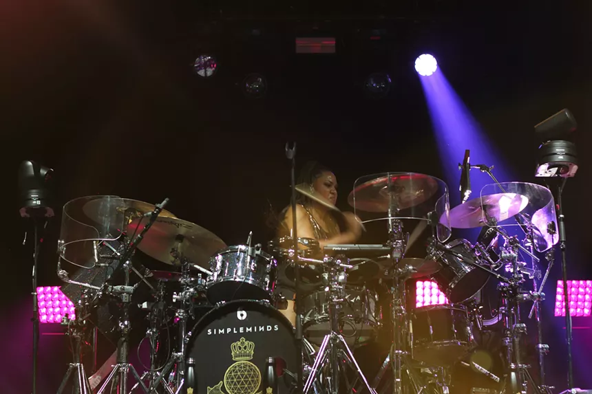 Man drumming on stage