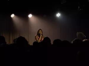 Woman singing on stage