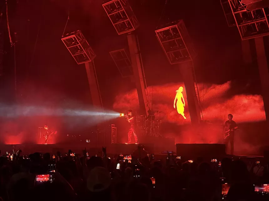 Man on stage with a megaphone