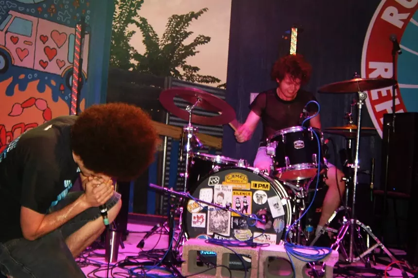 Two guys performing on stage