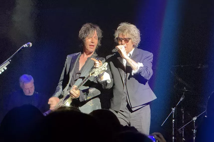 Frontman Richard Butler commands the spotlight with his signature raspy vocals and magnetic stage presence.