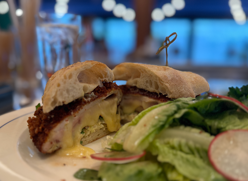 cordon bleu sandwich with a salad.