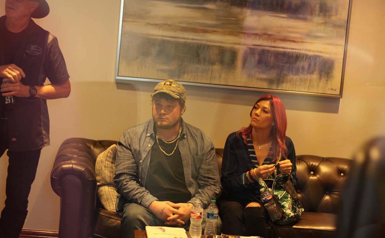 Kyle Vess (middle) sits next to his sister, Shelbi Madden, ahead of a press conference in November.