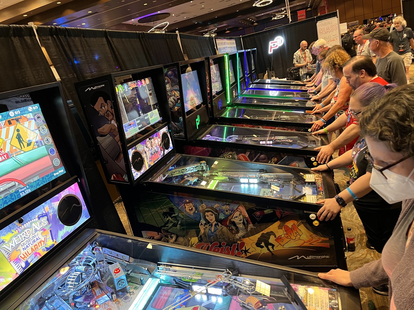 Guests of the Texas Pinball Festival at the Frisco Convention Center test drive some new games from Multimorphic Pinball.