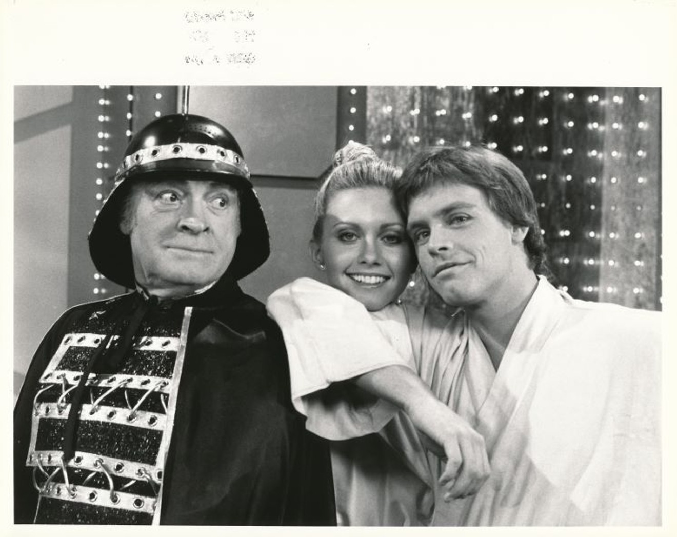 Star Wars cast member Mark Hamill, right, plays himself in a parody sketch on The Bob Hope Christmas Special in 1977, with Bob Hope as "Barf Vader" and singer Olivia Newton John as Princess Hialeah.
