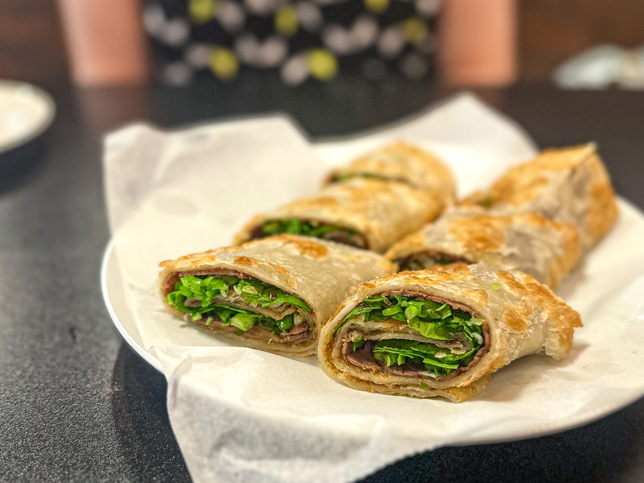 We lose the noodle-pulling floor show from the prior resident but gain some delectable treats from Steam Dumpling such as the beef roll pancake.