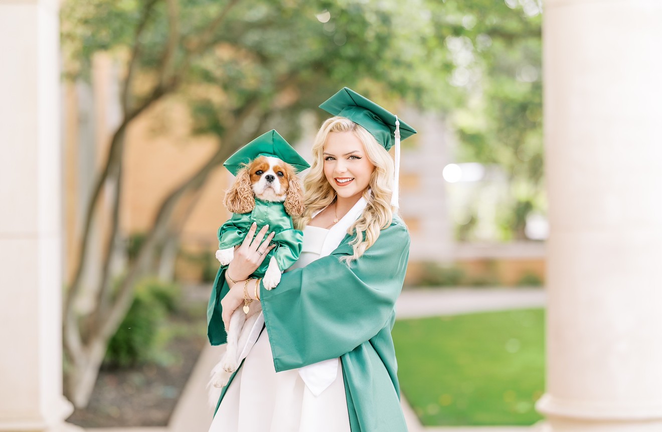 UNT student Lauren Clark and her dog Holly pose for Clark's graduation photos. Holly's cap and gown was made by Kari Sawers, whose work can be seen on Instagram.