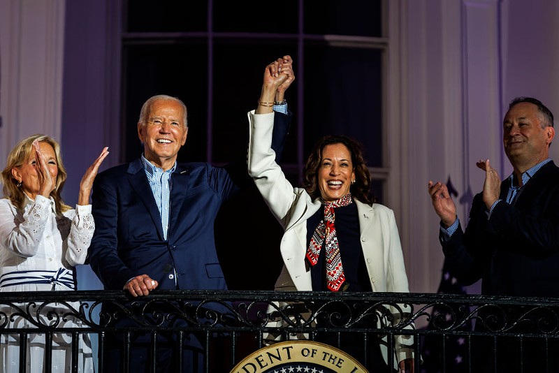 President Joe Biden and Vice President Kamala Harris join hands while viewing the fireworks on the National Mall with First Lady Jill Biden and Second Gentleman Doug Emhoff on July 4, 2024.