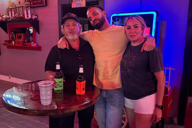Image: Man posing with fans