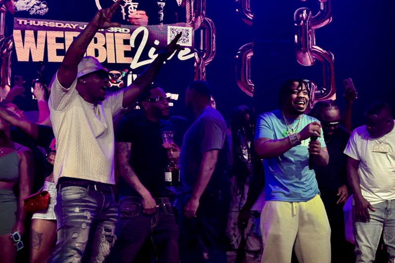 Image: A picture of a rapper on stage
