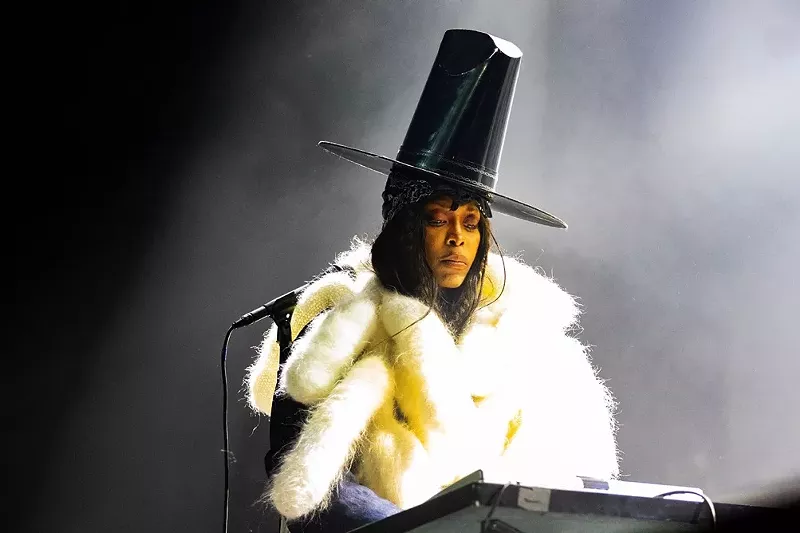 Image: Erykah Badu, seen in a large hat performing in Dallas, has been dragged into the Nicki Minaj/Megan Thee Stallion feud.