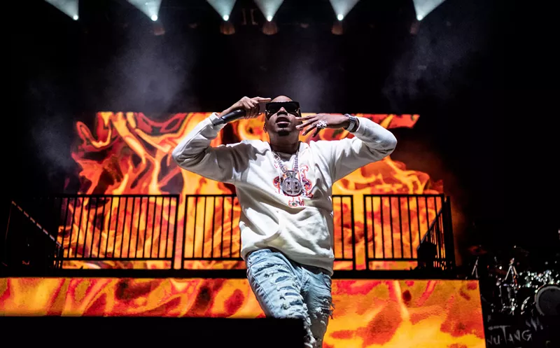 Image: Nas, seen here challenging the audience to hate him now, knowing very well that he won't stop now, 'cause he can't stop now.